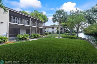 Lovely light and bright first floor corner unit overlooking the on Deer Creek Golf Club in Florida - for sale on GolfHomes.com, golf home, golf lot