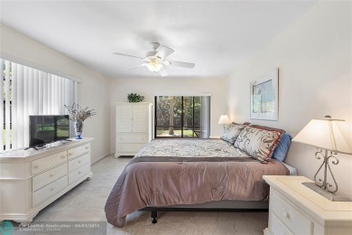 Lovely light and bright first floor corner unit overlooking the on Deer Creek Golf Club in Florida - for sale on GolfHomes.com, golf home, golf lot