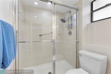 Lovely light and bright first floor corner unit overlooking the on Deer Creek Golf Club in Florida - for sale on GolfHomes.com, golf home, golf lot