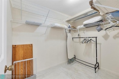 Lovely light and bright first floor corner unit overlooking the on Deer Creek Golf Club in Florida - for sale on GolfHomes.com, golf home, golf lot