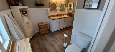 Come settle down and relax in a beautiful, manufactured home on Fairways Country Club in Florida - for sale on GolfHomes.com, golf home, golf lot