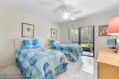 Lovely light and bright first floor corner unit overlooking the on Deer Creek Golf Club in Florida - for sale on GolfHomes.com, golf home, golf lot