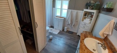 Come settle down and relax in a beautiful, manufactured home on Fairways Country Club in Florida - for sale on GolfHomes.com, golf home, golf lot