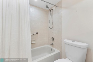 Lovely light and bright first floor corner unit overlooking the on Deer Creek Golf Club in Florida - for sale on GolfHomes.com, golf home, golf lot