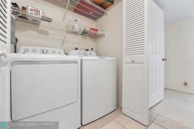 Lovely light and bright first floor corner unit overlooking the on Deer Creek Golf Club in Florida - for sale on GolfHomes.com, golf home, golf lot