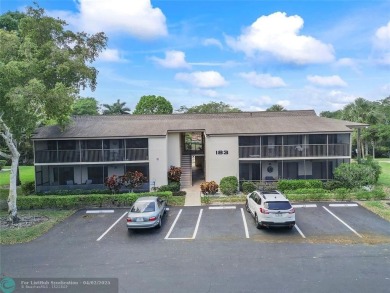 Lovely light and bright first floor corner unit overlooking the on Deer Creek Golf Club in Florida - for sale on GolfHomes.com, golf home, golf lot