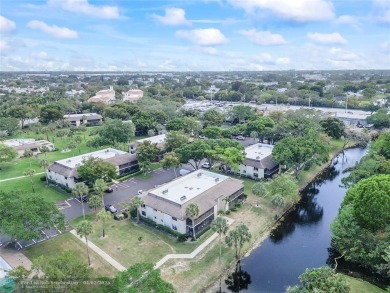 Lovely light and bright first floor corner unit overlooking the on Deer Creek Golf Club in Florida - for sale on GolfHomes.com, golf home, golf lot