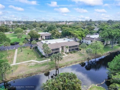 Lovely light and bright first floor corner unit overlooking the on Deer Creek Golf Club in Florida - for sale on GolfHomes.com, golf home, golf lot