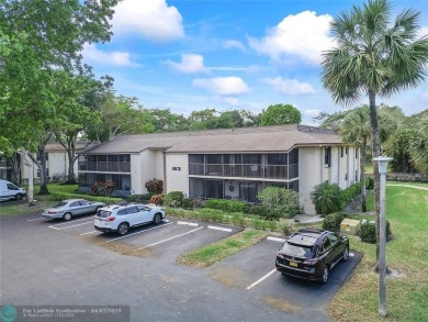Lovely light and bright first floor corner unit overlooking the on Deer Creek Golf Club in Florida - for sale on GolfHomes.com, golf home, golf lot