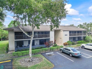 Lovely light and bright first floor corner unit overlooking the on Deer Creek Golf Club in Florida - for sale on GolfHomes.com, golf home, golf lot