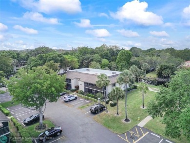 Lovely light and bright first floor corner unit overlooking the on Deer Creek Golf Club in Florida - for sale on GolfHomes.com, golf home, golf lot
