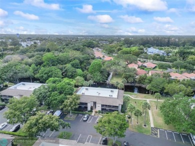 Lovely light and bright first floor corner unit overlooking the on Deer Creek Golf Club in Florida - for sale on GolfHomes.com, golf home, golf lot