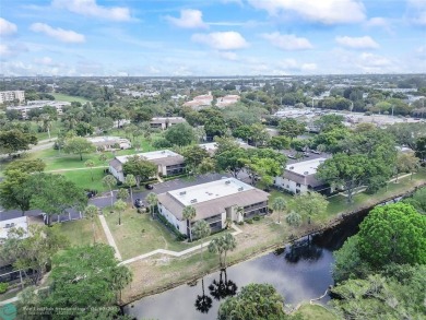Lovely light and bright first floor corner unit overlooking the on Deer Creek Golf Club in Florida - for sale on GolfHomes.com, golf home, golf lot