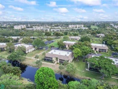 Lovely light and bright first floor corner unit overlooking the on Deer Creek Golf Club in Florida - for sale on GolfHomes.com, golf home, golf lot