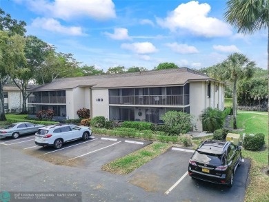 Lovely light and bright first floor corner unit overlooking the on Deer Creek Golf Club in Florida - for sale on GolfHomes.com, golf home, golf lot