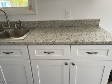 Move into a home that feels like brand-new construction in the on Riverbend Golf and Country Club in Florida - for sale on GolfHomes.com, golf home, golf lot