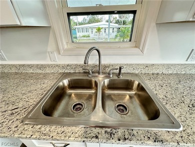 Move into a home that feels like brand-new construction in the on Riverbend Golf and Country Club in Florida - for sale on GolfHomes.com, golf home, golf lot