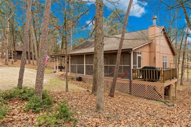 Enjoy this darling 2 bedroom & 2 bath home on two lots with two on Holly Lake Ranch Golf Club in Texas - for sale on GolfHomes.com, golf home, golf lot
