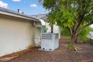 This lovely three-bedroom, two-bath home in Sun City features a on Sun City Country Club in Arizona - for sale on GolfHomes.com, golf home, golf lot