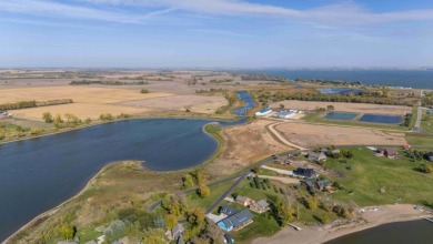 Over half acre lot with 100 feet of shoreline on Lake Albert on Lake Region Golf Course in South Dakota - for sale on GolfHomes.com, golf home, golf lot