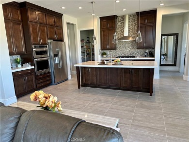 This home comes with approximately $300,000 in upgrades on Mission Hills Golf Club in California - for sale on GolfHomes.com, golf home, golf lot