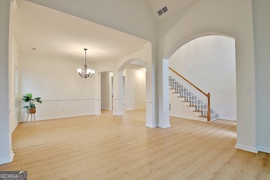 Welcome to this warm and inviting home in the beloved Planterra on Canongate At Planterra Ridge in Georgia - for sale on GolfHomes.com, golf home, golf lot