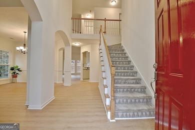 Welcome to this warm and inviting home in the beloved Planterra on Canongate At Planterra Ridge in Georgia - for sale on GolfHomes.com, golf home, golf lot