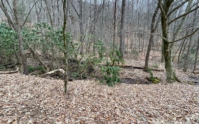 BEAUTIFULLY WOODED LOT IN UPSCALE SUBDIVISION IN THE MOUNTAINS on Mountain Harbour Golf Club in North Carolina - for sale on GolfHomes.com, golf home, golf lot