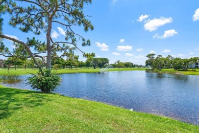 Immerse yourself in the beauty of the surrounding landscape on Quail Ridge Golf Course and Country Club in Florida - for sale on GolfHomes.com, golf home, golf lot