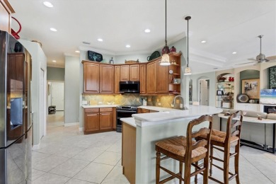 Former Model Home with Exceptional Upgrades and Panoramic Golf on Pelican Pointe Golf and Country Club in Florida - for sale on GolfHomes.com, golf home, golf lot