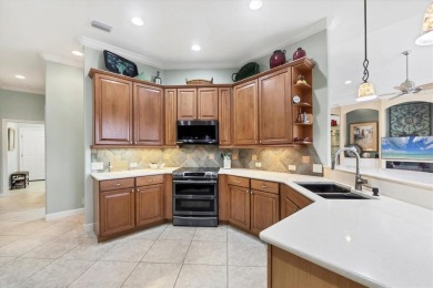 Former Model Home with Exceptional Upgrades and Panoramic Golf on Pelican Pointe Golf and Country Club in Florida - for sale on GolfHomes.com, golf home, golf lot