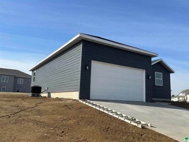 Let's take a look at this new build in Akron, Iowa. This on Akron Golf Course in Iowa - for sale on GolfHomes.com, golf home, golf lot