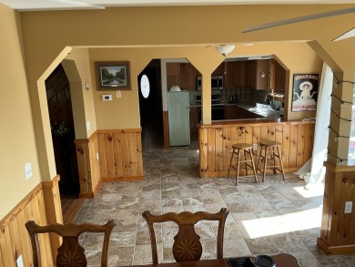 Experience luxury and serenity with this beautifully appointed 3 on Eagle Ridge Golf Course in Michigan - for sale on GolfHomes.com, golf home, golf lot