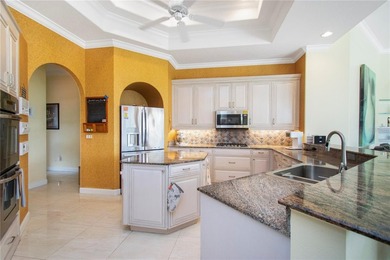 Experience refined luxury and timeless craftsmanship in this on University Park Country Club in Florida - for sale on GolfHomes.com, golf home, golf lot