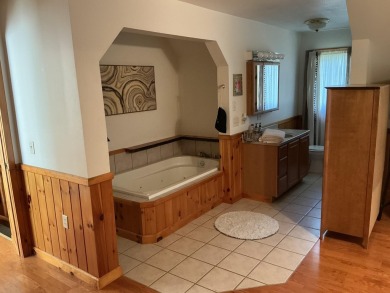 Experience luxury and serenity with this beautifully appointed 3 on Eagle Ridge Golf Course in Michigan - for sale on GolfHomes.com, golf home, golf lot