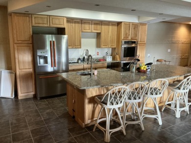 Experience luxury and serenity with this beautifully appointed 3 on Eagle Ridge Golf Course in Michigan - for sale on GolfHomes.com, golf home, golf lot