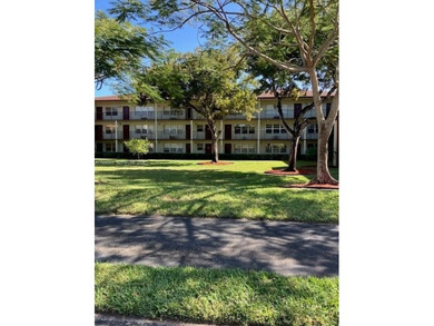 CHARMING 2BR 1.5 BA APARTMENT WITH RELAXING POOL & GARDEN VIEW on Flamingo Lakes Country Club in Florida - for sale on GolfHomes.com, golf home, golf lot