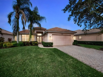Beautifully designed and ideally situated on the lake, this on PGA Golf Club in PGA Village in Florida - for sale on GolfHomes.com, golf home, golf lot