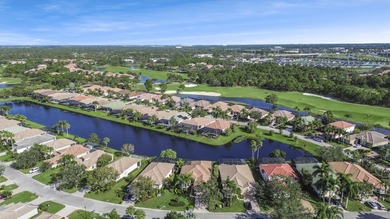 Beautifully designed and ideally situated on the lake, this on PGA Golf Club in PGA Village in Florida - for sale on GolfHomes.com, golf home, golf lot