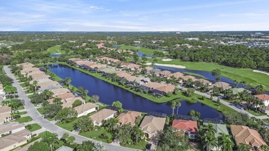 Beautifully designed and ideally situated on the lake, this on PGA Golf Club in PGA Village in Florida - for sale on GolfHomes.com, golf home, golf lot