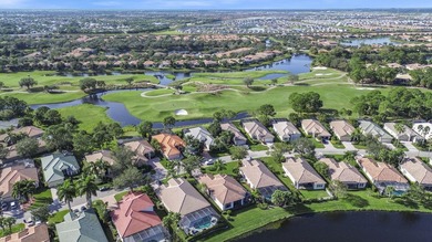 Beautifully designed and ideally situated on the lake, this on PGA Golf Club in PGA Village in Florida - for sale on GolfHomes.com, golf home, golf lot