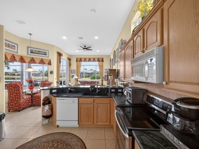 Beautifully designed and ideally situated on the lake, this on PGA Golf Club in PGA Village in Florida - for sale on GolfHomes.com, golf home, golf lot