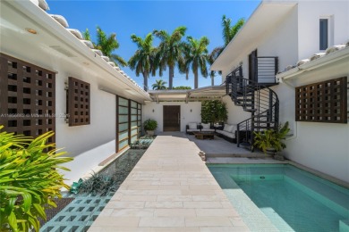 OVERSIZED WATERFRONT HOME WITH 80FT OF WATERFRONTAGE & GOLF on Miami Beach Golf Club in Florida - for sale on GolfHomes.com, golf home, golf lot