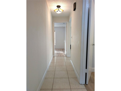 Under contract-accepting backup offers. Pride of ownership is on Mainlands Golf Club in Florida - for sale on GolfHomes.com, golf home, golf lot