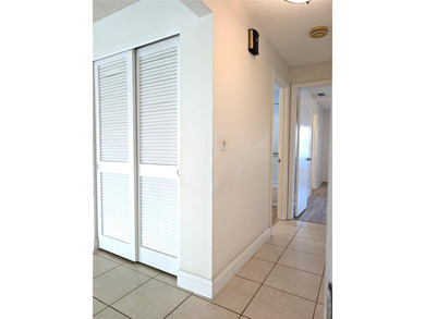 Under contract-accepting backup offers. Pride of ownership is on Mainlands Golf Club in Florida - for sale on GolfHomes.com, golf home, golf lot