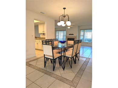 Under contract-accepting backup offers. Pride of ownership is on Mainlands Golf Club in Florida - for sale on GolfHomes.com, golf home, golf lot