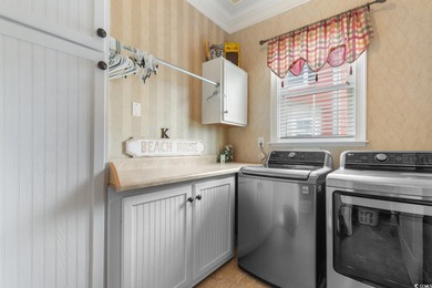 Welcome to 1516 James Island Avenue, a stunning custom-built on Tidewater Golf Club and Plantation in South Carolina - for sale on GolfHomes.com, golf home, golf lot