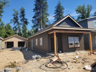 Charming 2-bedroom, 2-bath cottage nestled in a peaceful on Sandpoint Elks Golf Course in Idaho - for sale on GolfHomes.com, golf home, golf lot