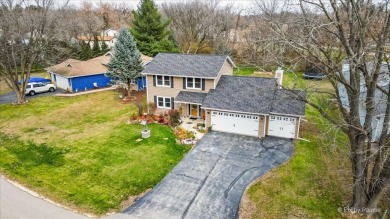 This stunning home is packed with updates and offers a lifestyle on Savannah Oaks Golf Club of Candlewick Lake in Illinois - for sale on GolfHomes.com, golf home, golf lot