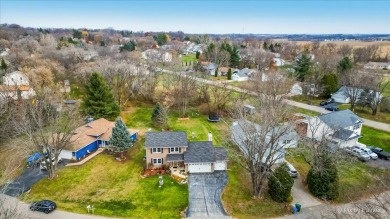 This stunning home is packed with updates and offers a lifestyle on Savannah Oaks Golf Club of Candlewick Lake in Illinois - for sale on GolfHomes.com, golf home, golf lot